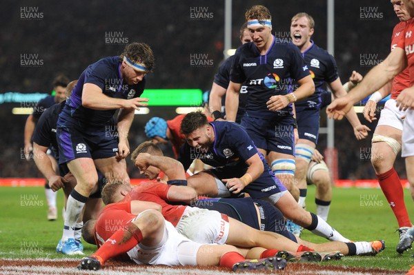 031118 - Wales v Scotland - Under Armour Series - Scotland players celebrate after scoring a try