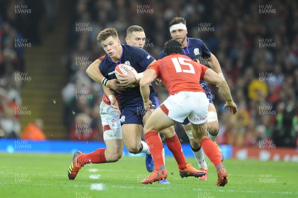 031118 - Wales v Scotland - Under Armour Series - Huw Jones of Scotland  is tackled by George North of Wales 