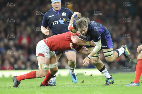 031118 - Wales v Scotland - Under Armour Series - Ben Toolis of Scotland is tackled by Dan Lydiate of Wales 
