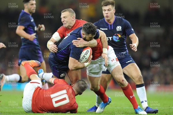 031118 - Wales v Scotland - Under Armour Series - Alex Dunbar of Scotland  is tackled by Gareth Anscombe of Wales and Hadleigh Parkes of Wales 