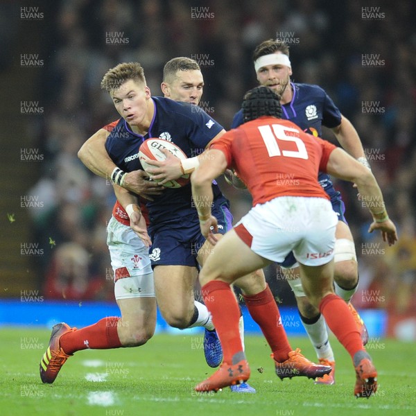 031118 - Wales v Scotland - Under Armour Series - Huw Jones of Scotland is tackled by George North of Wales 