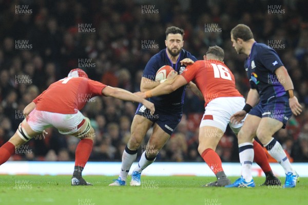 031118 - Wales v Scotland - Under Armour Series - Alex Dunbar of Scotland is tackled by Cory Hill of Wales and Elliot Dee of Wales 