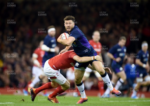031118 - Wales v Scotland - Doddle Weir Cup -  Ali Price of Scotland is tackled by Gareth Anscombe of Wales 