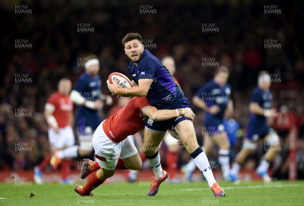 031118 - Wales v Scotland - Doddle Weir Cup -  Ali Price of Scotland is tackled by Gareth Anscombe of Wales 