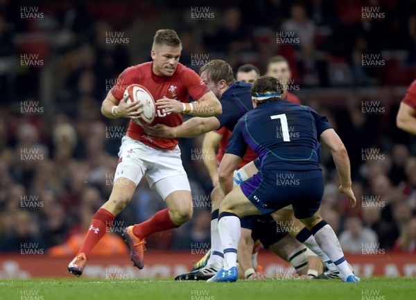 031118 - Wales v Scotland - Doddle Weir Cup -  Gareth Anscombe of Wales is tackled by Jonny Gray and Hamish Watson of Scotland 