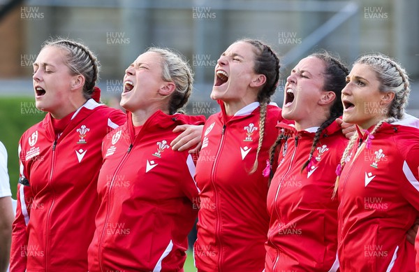 091022 - Wales v Scotland, Women’s Rugby World Cup 2021 Pool A - Wales’ Hannah Jones, Alisha Butchers, Jasmine Joyce, Ffion Lewis and Lowri Norkett sing the national anthem at the start of the match