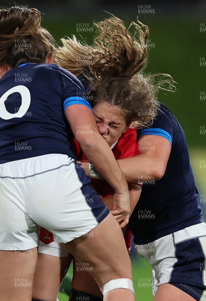 091022 - Wales v Scotland, Women’s Rugby World Cup 2021 Pool A - Natalia John of Wales is tackled by Helen Nelson of Scotland and Sarah Bonar of Scotland