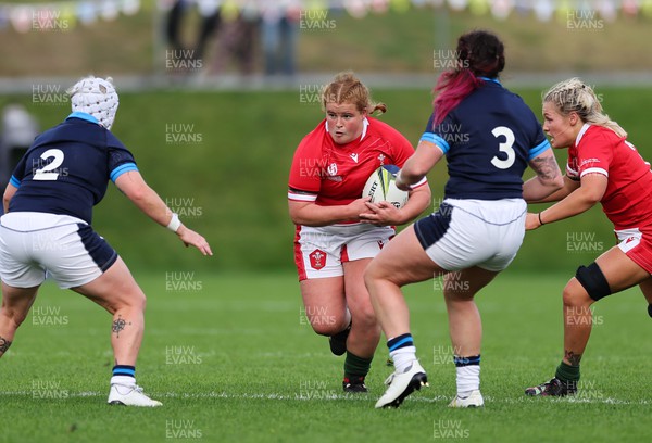 091022 - Wales v Scotland, Women’s Rugby World Cup 2021 Pool A - Cara Hope of Wales takes on Lana Skeldon of Scotland and Christine Belisle of Scotland
