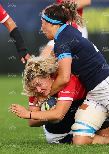091022 - Wales v Scotland, Women’s Rugby World Cup 2021 Pool A - Alex Callender of Wales is tackled by Rachel Malcolm of Scotland and Emma Wassell of Scotland