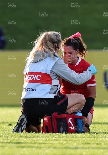 091022 - Wales v Scotland, Women’s Rugby World Cup 2021 Pool A - Medic Jo Perkins treats Georgia Evans of Wales
