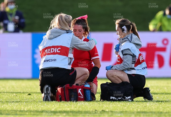 091022 - Wales v Scotland, Women’s Rugby World Cup 2021 Pool A - Medics Jo Perkins and Cara Jones treat Georgia Evans of Wales