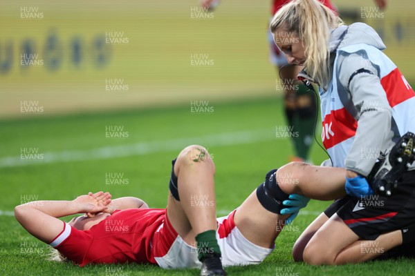 091022 - Wales v Scotland, Women’s Rugby World Cup 2021 Pool A - Medic Jo Perkins treats Alisha Butchers of Wales