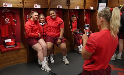 110426 - Wales v Scotland, Guinness Women’s 6 Nations - Gwenllian Pyrs of Wales, Kelsey Jones of Wales and Sisilia Tuipulotu of Wales in the changing room ahead of the match