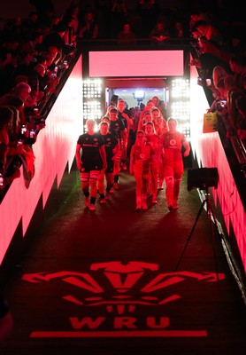 110426 - Wales v Scotland, Guinness Women’s 6 Nations - Wales captain Kate Williams and mascot Nell Rolfe make their way to the pitch for the start of the match