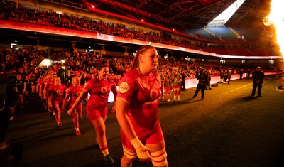 110426 - Wales v Scotland, Guinness Women’s 6 Nations - Wales captain Kate Williams and mascot Nell Rolfe make their way to the pitch for the start of the match