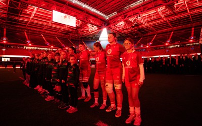 110426 - Wales v Scotland, Guinness Women’s 6 Nations - Wales captain Kate Williams and mascot Nell Rolfe line up for the anthem
