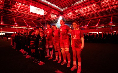 110426 - Wales v Scotland, Guinness Women’s 6 Nations - Wales captain Kate Williams and mascot Nell Rolfe line up for the anthem