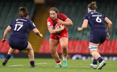 110426 - Wales v Scotland, Guinness Women’s 6 Nations - Maisie Davies of Wales takes on Demi Swann of Scotland  and Rachel Malcolm of Scotland 