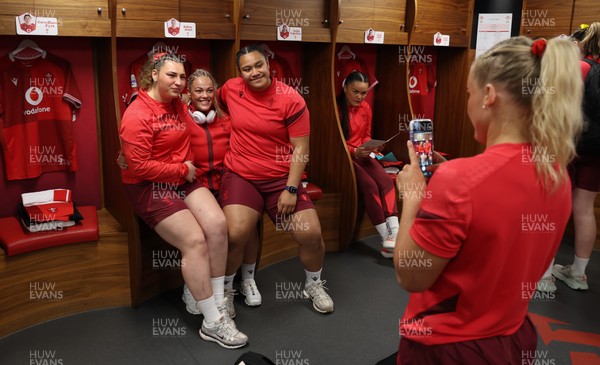 110426 - Wales v Scotland, Guinness Women’s 6 Nations - Gwenllian Pyrs of Wales, Kelsey Jones of Wales and Sisilia Tuipulotu of Wales in the changing room ahead of the match