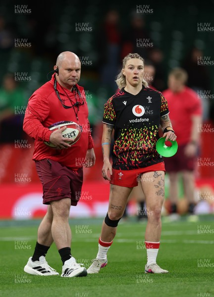 110426 - Wales v Scotland, Guinness Women’s 6 Nations -Sean Lynn, Wales Women head coach and Keira Bevan of Wales during warm up
