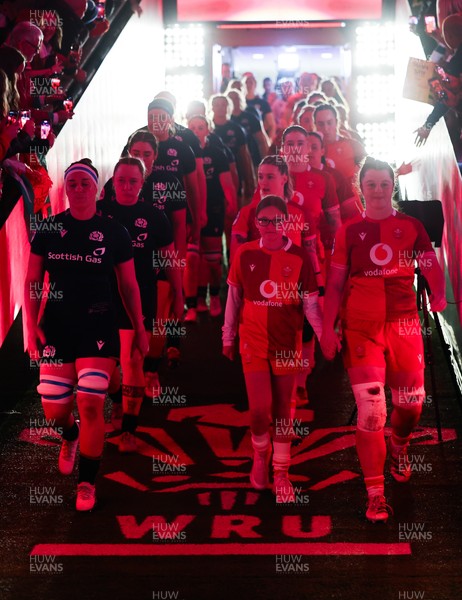 110426 - Wales v Scotland, Guinness Women’s 6 Nations - Wales captain Kate Williams and mascot Nell Rolfe make their way to the pitch for the start of the match