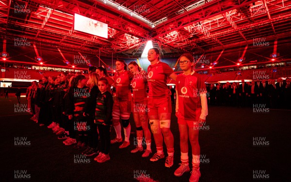 110426 - Wales v Scotland, Guinness Women’s 6 Nations - Wales captain Kate Williams and mascot Nell Rolfe line up for the anthem