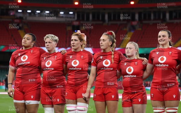 110426 - Wales v Scotland, Guinness Women’s 6 Nations - Wales players, Sisilia Tuipulotu, Donna Rose, Georgia Evans, Hannah Dallavalle, Seren Lockwood and Branwen Metcalfe during the anthem