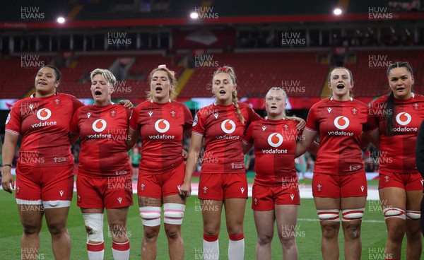 110426 - Wales v Scotland, Guinness Women’s 6 Nations - Wales players, Sisilia Tuipulotu, Donna Rose, Georgia Evans, Hannah Dallavalle, Seren Lockwood, Branwen Metcalfe and Jorja Aiono during the anthem