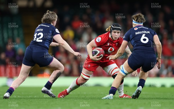 110426 - Wales v Scotland, Guinness Women’s 6 Nations - Bethan Lewis of Wales takes on Meryl Smith of Scotland and Rachel Malcolm of Scotland 