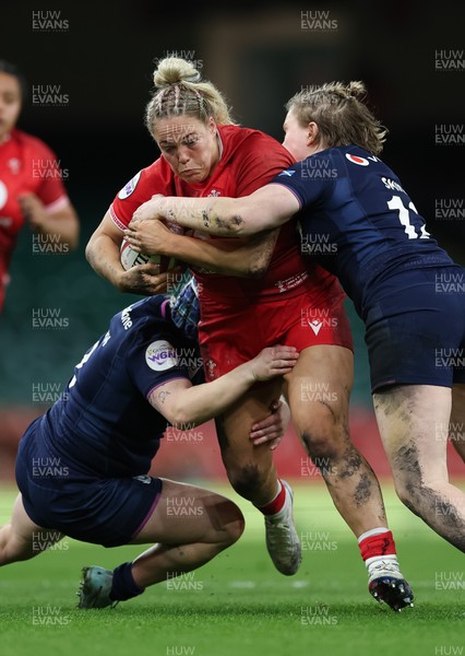 110426 - Wales v Scotland, Guinness Women’s 6 Nations - Kelsey Jones of Wales takes on Meryl Smith of Scotland 
