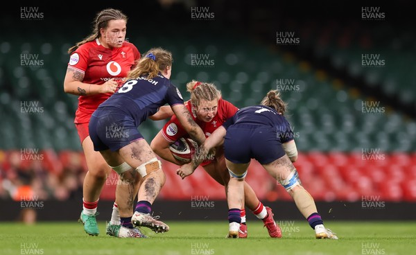 110426 - Wales v Scotland, Guinness Women’s 6 Nations - Molly Reardon of Wales is held by Alex Stewart of Scotland  and Emily Coubrough of Scotland 