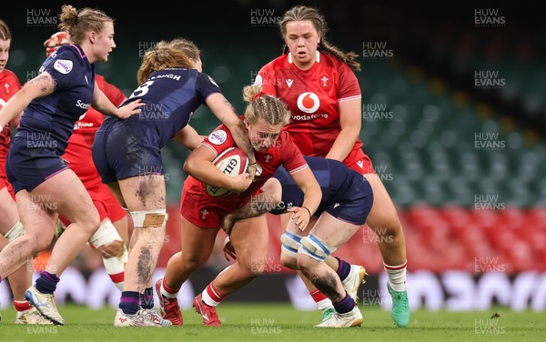 110426 - Wales v Scotland, Guinness Women’s 6 Nations - Molly Reardon of Wales is held by Alex Stewart of Scotland  and Emily Coubrough of Scotland 