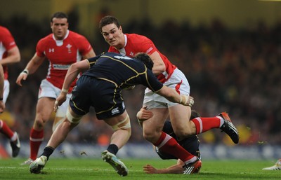 120212 - Wales v Scotland - RBS Six Nations 2012 -George North of Wales is tackled by Ross Rennie of Scotland