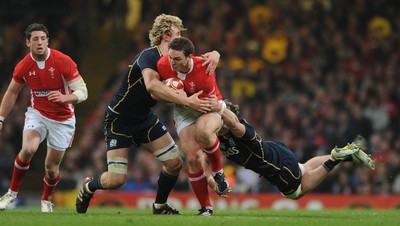 120212 - Wales v Scotland - RBS Six Nations 2012 -George North of Wales is tackled by Richie Gray of Scotland