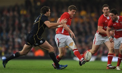 120212 - Wales v Scotland- RBS Six Nations 2012 -Rhys Priestland of Wales chips past Sean Lamont of Scotland