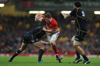 120212 - Wales v Scotland - RBS Six Nations 2012 -Rhys Priestland of Wales is tackled by Sean Lamont of Scotland