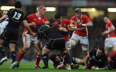 120212 - Wales v Scotland - RBS Six Nations 2012 -Mike Phillips of Wales is tackled by Allan Jacobsen of Scotland