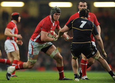 120212 - Wales v Scotland - RBS Six Nations 2012 -Dan Lydiate of Wales takes on Ross Rennie of Scotland