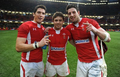 120212 - Wales v Scotland - RBS Six Nations 2012 -James Hook, Leigh Halfpenny and Alex Cuthbert of Wales celebrate at the end of the game