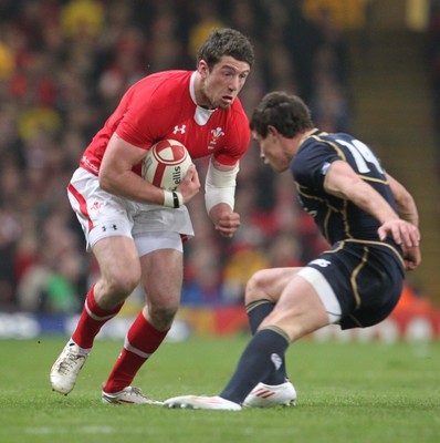 120212 - Wales v Scotland - RBS 6 Nations -Wales' Alex Cuthbert is tackled by Scotland's Lee Jones