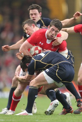 120212 - Wales v Scotland - RBS 6 Nations -Wales' Alex Cuthbert is tackled by Scotland's Lee Jones