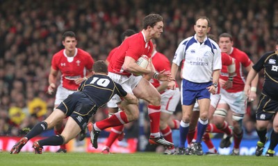 120212 - Wales v Scotland - RBS 6 Nations -Wales' George North is tackled by Scotland's Greig Laidlaw