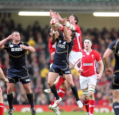 120212 - Wales v Scotland - RBS 6 Nations -Scotland's Chris Cusiter and Alex Cuthbert compete for high ball