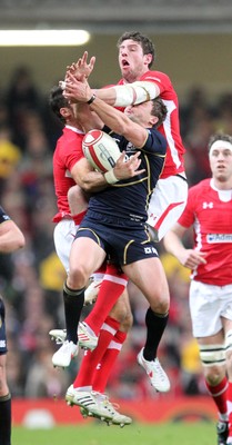 120212 - Wales v Scotland - RBS 6 Nations -Scotland's Chris Cusiter and Alex Cuthbert compete for high ball