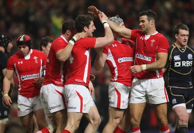 120212 - Wales v Scotland, RBS 6 Nations 2012 -Wales' Alex Cuthbert celebrates with Wales' Mike Phillips after scoring try