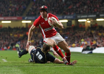 120212 - Wales v Scotland, RBS 6 Nations 2012 -Wales' Leigh Halfpenny races in to score his second try