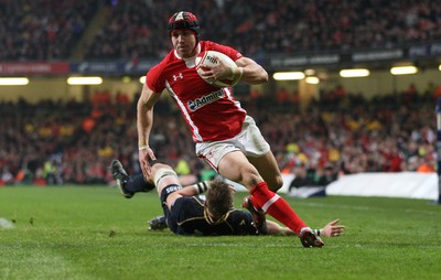 120212 - Wales v Scotland, RBS 6 Nations 2012 -Wales' Leigh Halfpenny races in to score his second try