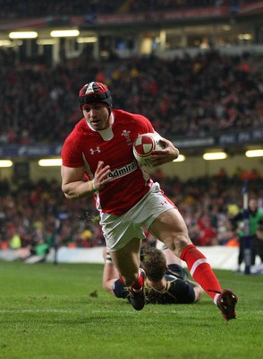 120212 - Wales v Scotland, RBS 6 Nations 2012 -Wales' Leigh Halfpenny races in to score his second try