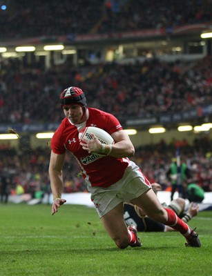 120212 - Wales v Scotland, RBS 6 Nations 2012 -Wales' Leigh Halfpenny races in to score his second try