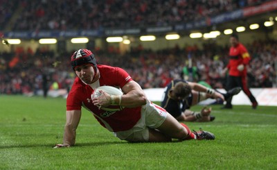 120212 - Wales v Scotland, RBS 6 Nations 2012 -Wales' Leigh Halfpenny races in to score his second try